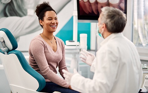 woman talking to cosmetic dentist in Conway