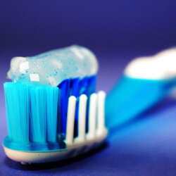 close up of toothpaste on  toothbrush