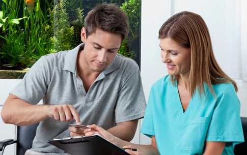 dental professional talking to patient 