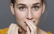 Woman covering her mouth