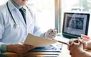 a dentist consulting with a patient