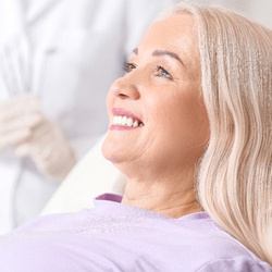 woman smiling after getting dental implants in Conway