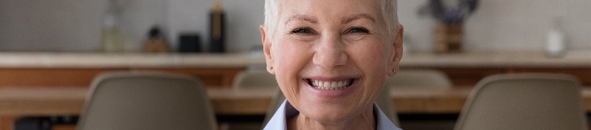 Woman smiling on a couch