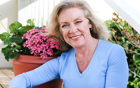 Older woman smiling outdoors