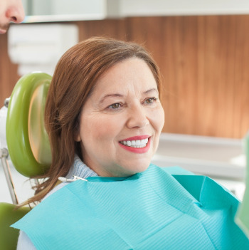 Woman smiling in the dental chair