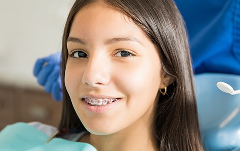 Teen girl with traditional braces