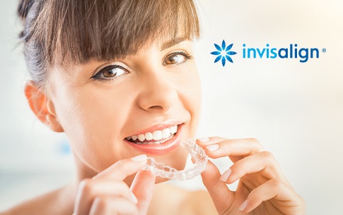 Woman placing an Invisalign tray