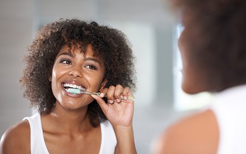 Woman brushing her teeth