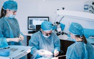 an oral surgeon placing dental implants in a patient