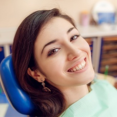 Woman in dental chair smiling