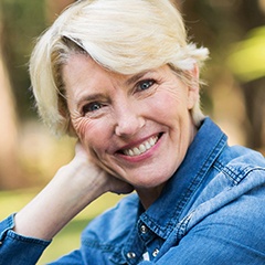 Older woman smiling outdoors