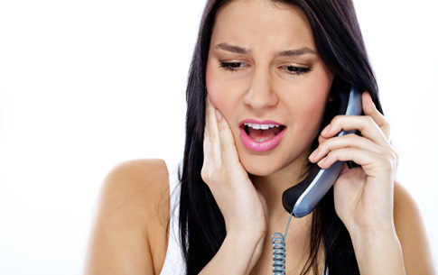 woman calling her Conway emergency dentist