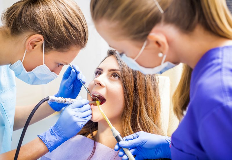 dentist putting dental filling in Conway on female patient’s tooth