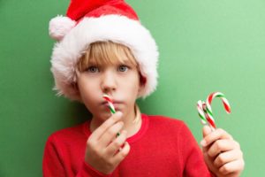 boy with a candy cane 